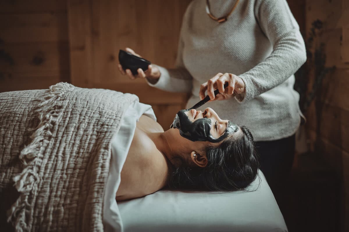 woman getting a mud facial