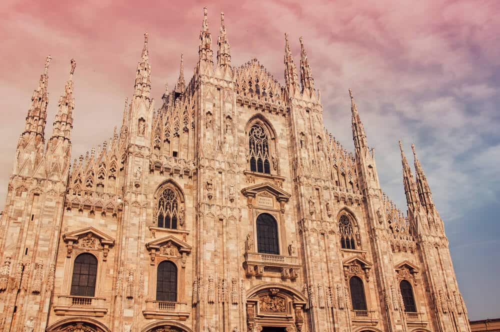 The Duomo Cathedral of Milan with pink sunset.