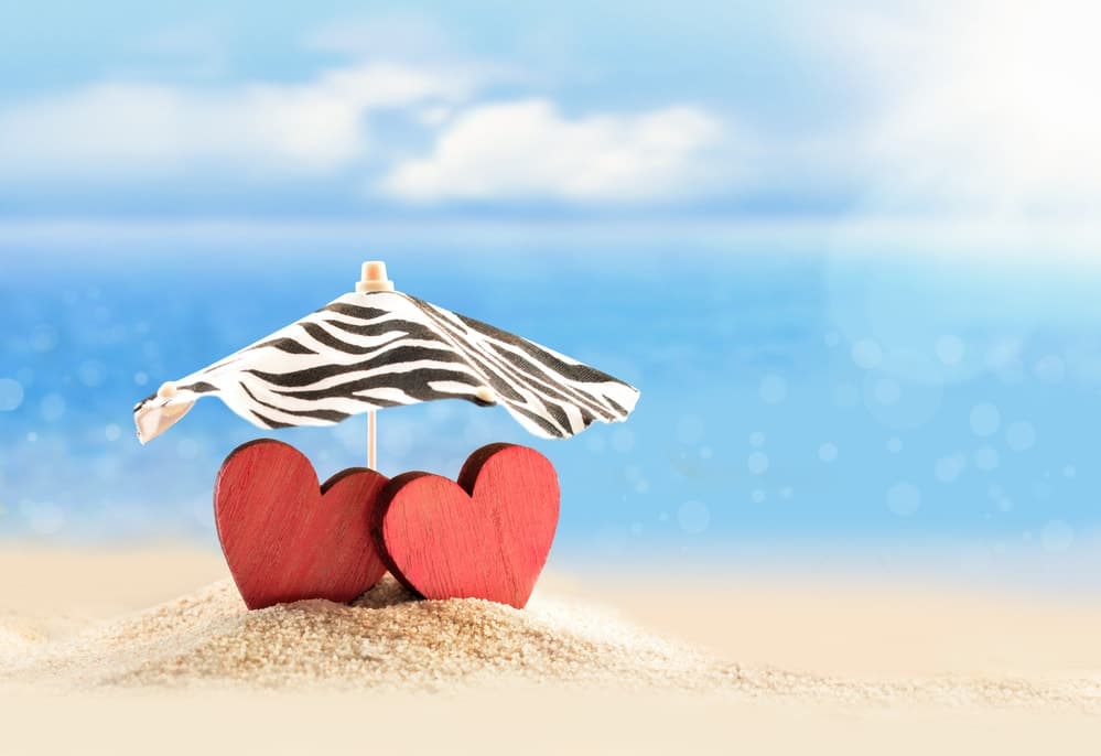two red hearts on a beach