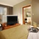 Hotel Le Crystal bedroom with flatscreen TV