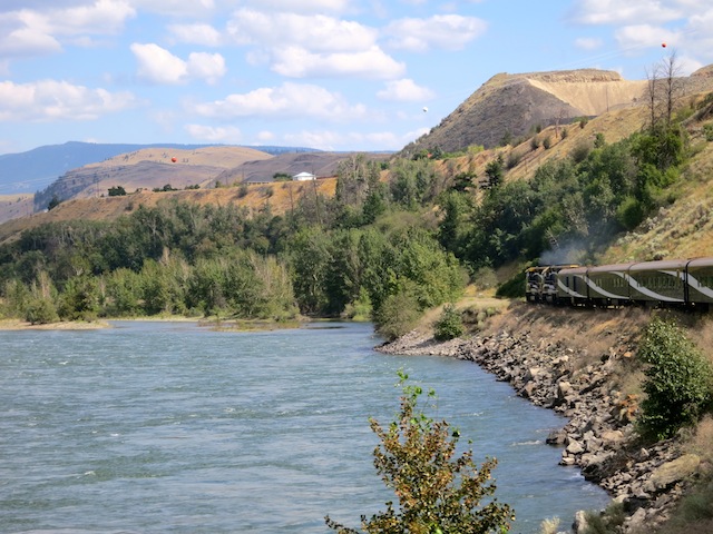 Rocky Mountaineer going by lake