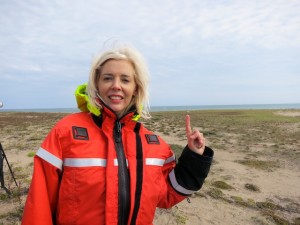 Wandering Carol on the tundra pointing to polar bear