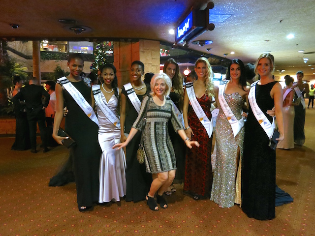 Wandering Carol, luxury travel blogger, photo bombing Miss South Africa contestants