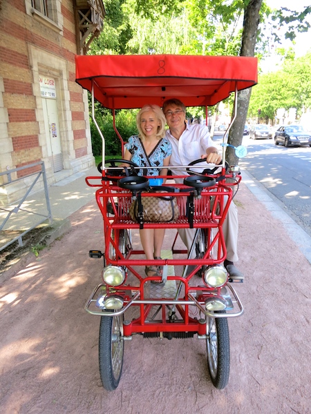 Carol Perehudoff and Mark Simpson on a canopy bicycle.