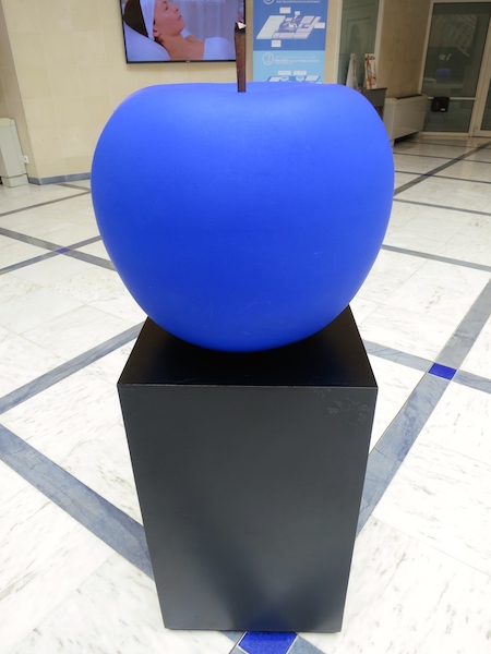 Blue apple sculpture.