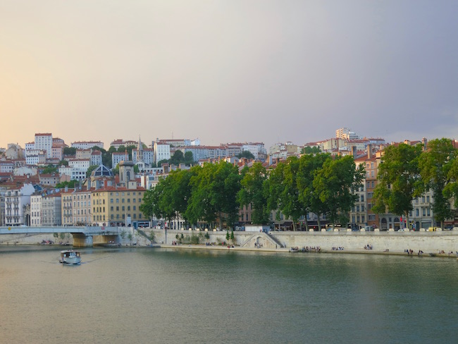 Golden view of Lyon from a boat cruise