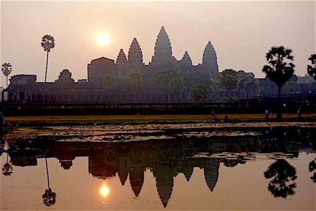 Angkor Wat sunrise with pale peach light