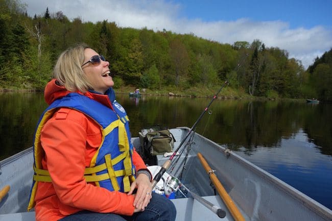 Woman laughing in a boat