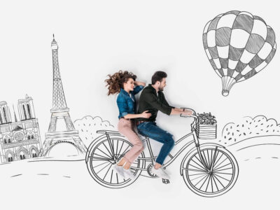 couple exploring Paris on a bicycle