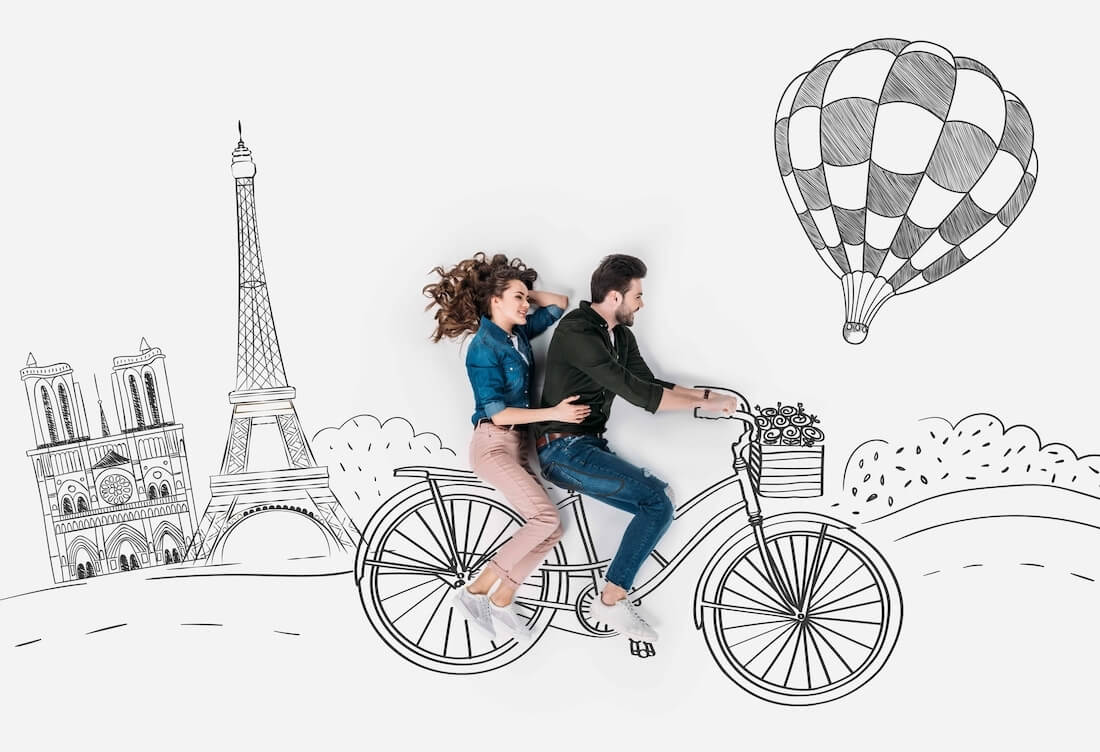 couple exploring Paris on a bicycle