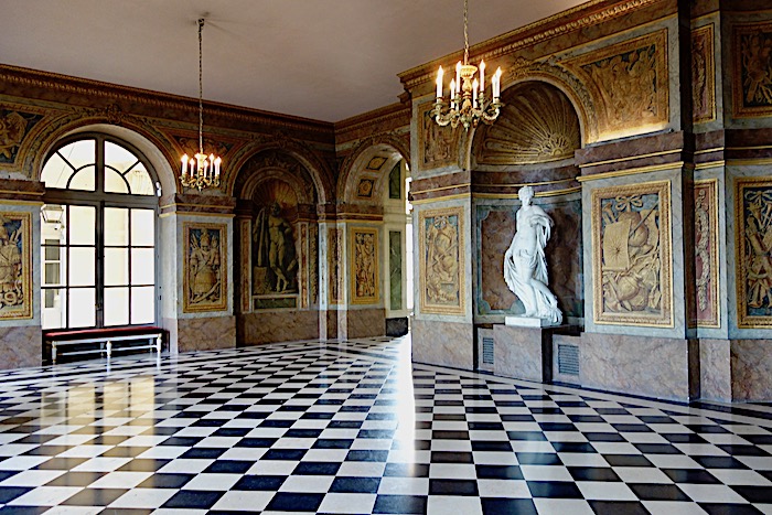 Inside Versailles with black and white floors and white statue