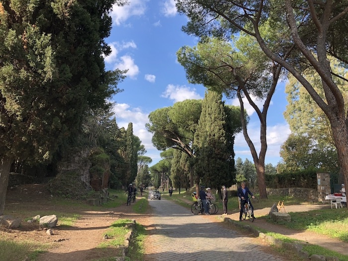 People cycling the Appian Way, a fun thing to do in Rome