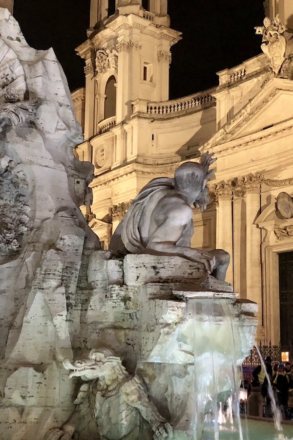Bernini sculpture at the Piazza Navona at night