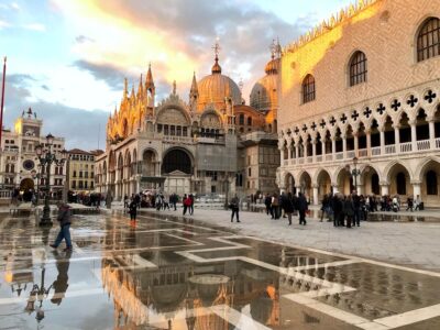 Beautiful sunset at St Mark's Square with wet ground