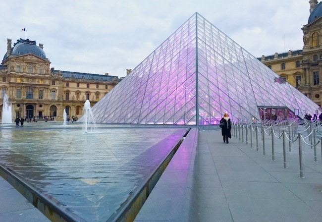 Pyramid at the Louvre with pink light