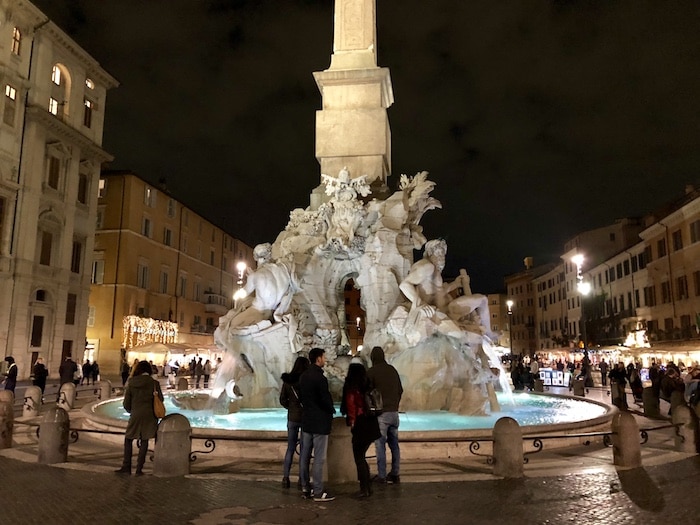 Bernini sculpture in Rome of Four Rivers Fountain at night in Piazza Navona