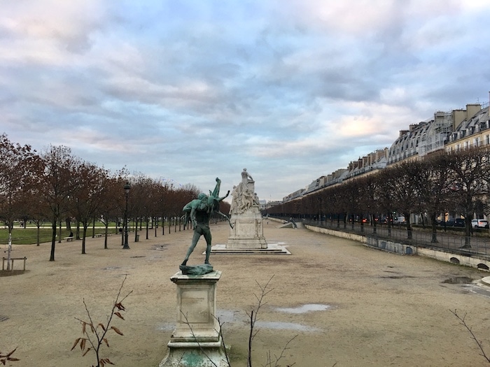 Shot of a Paris park under a cloudy sky