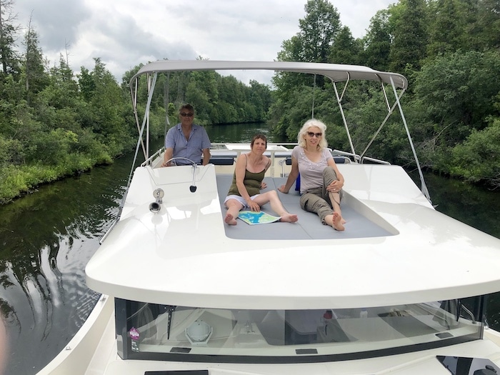 Driving our Le Boat cabin cruiser rental on the Rideau Canal in Ontario