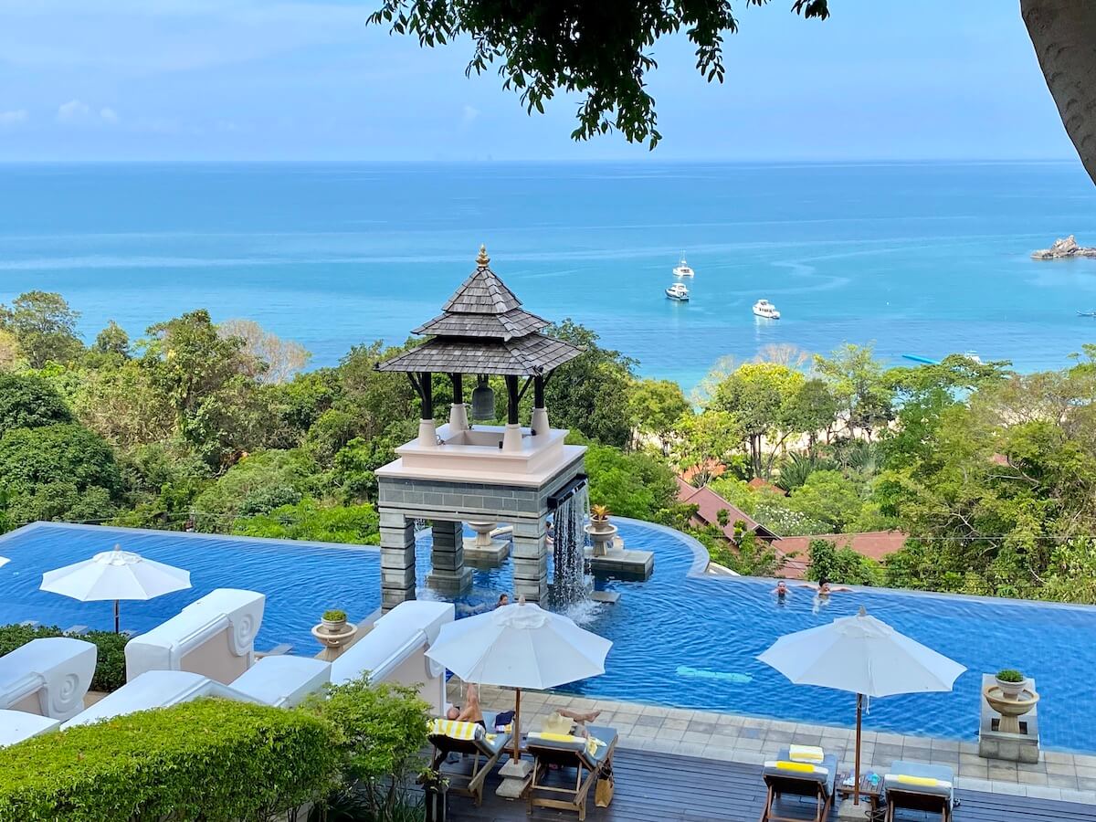 Swimming pool overlooking the ocean at a beautiful beach resort in Thailand. 