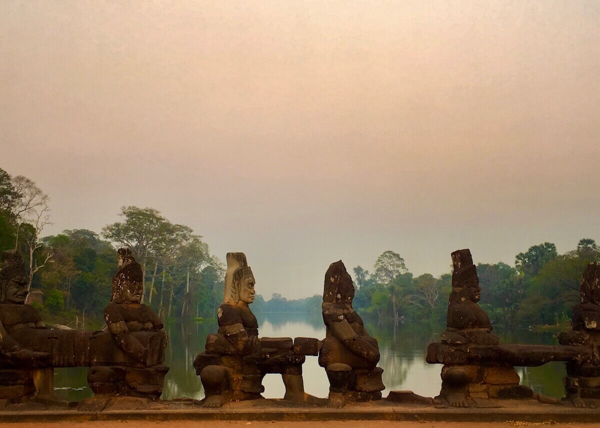 angkor wat sunset with statues