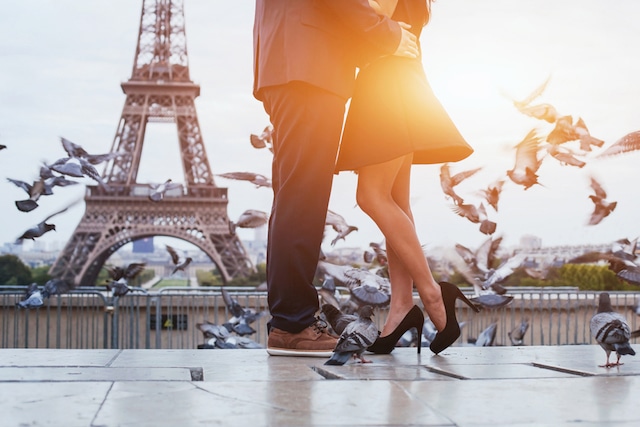 couple near Eiffel tower in Paris, romantic kiss