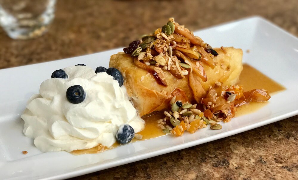 pastry with apple and whipped cream on the apple pie trail in collingwood