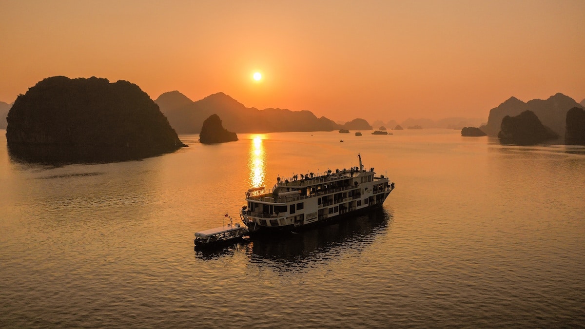 sunset view of a luxury halong bay cruise ship