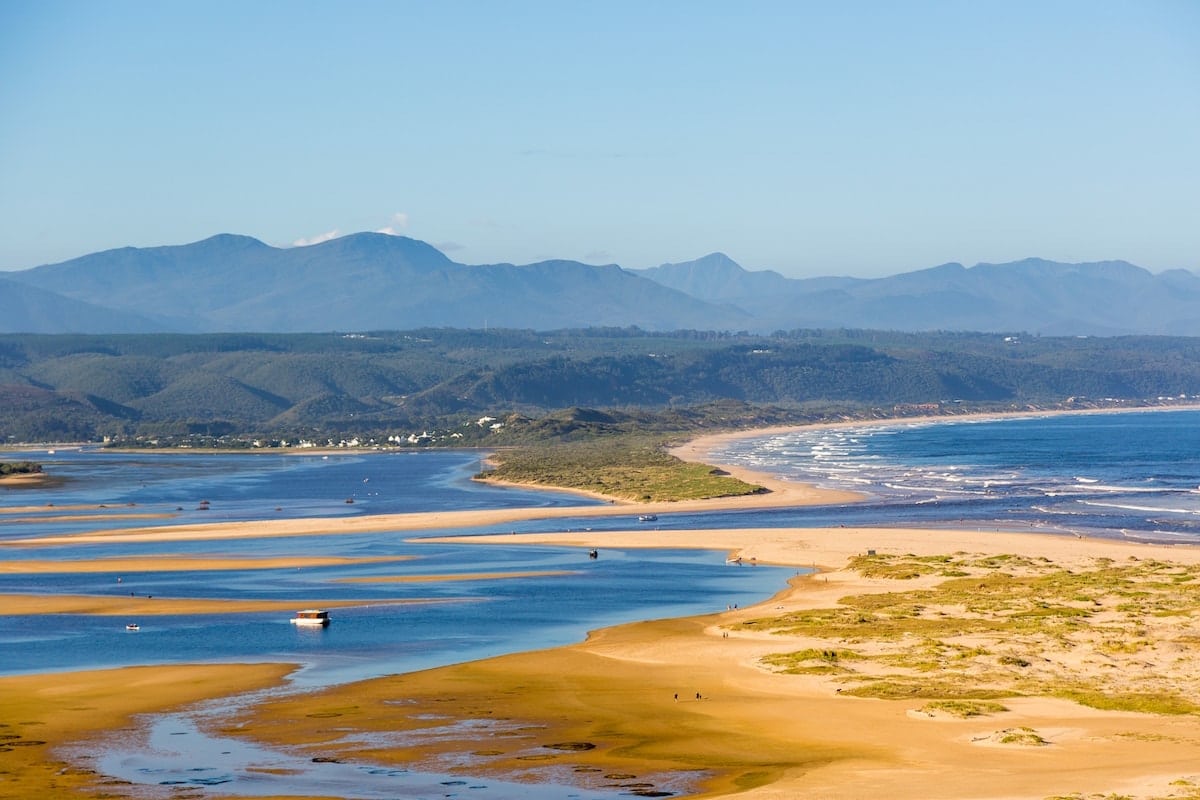 panoramic view of the beach, water and mountains at knysna in south africa