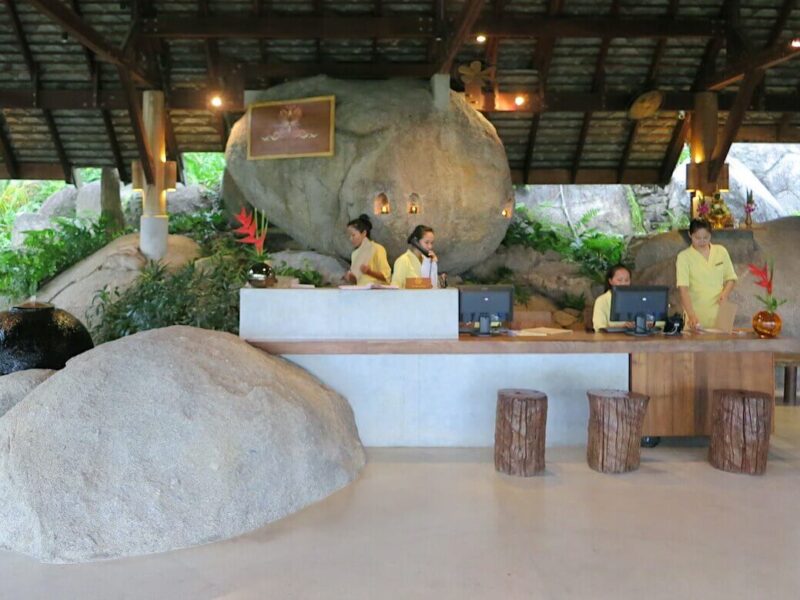 spa reception desk with mystical boulders at kamalaya spa in thailand