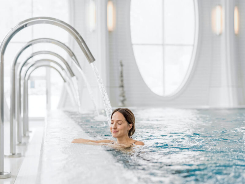 Woman in thermal pool at luxury destination spa Bad Ragaz in Switzerland