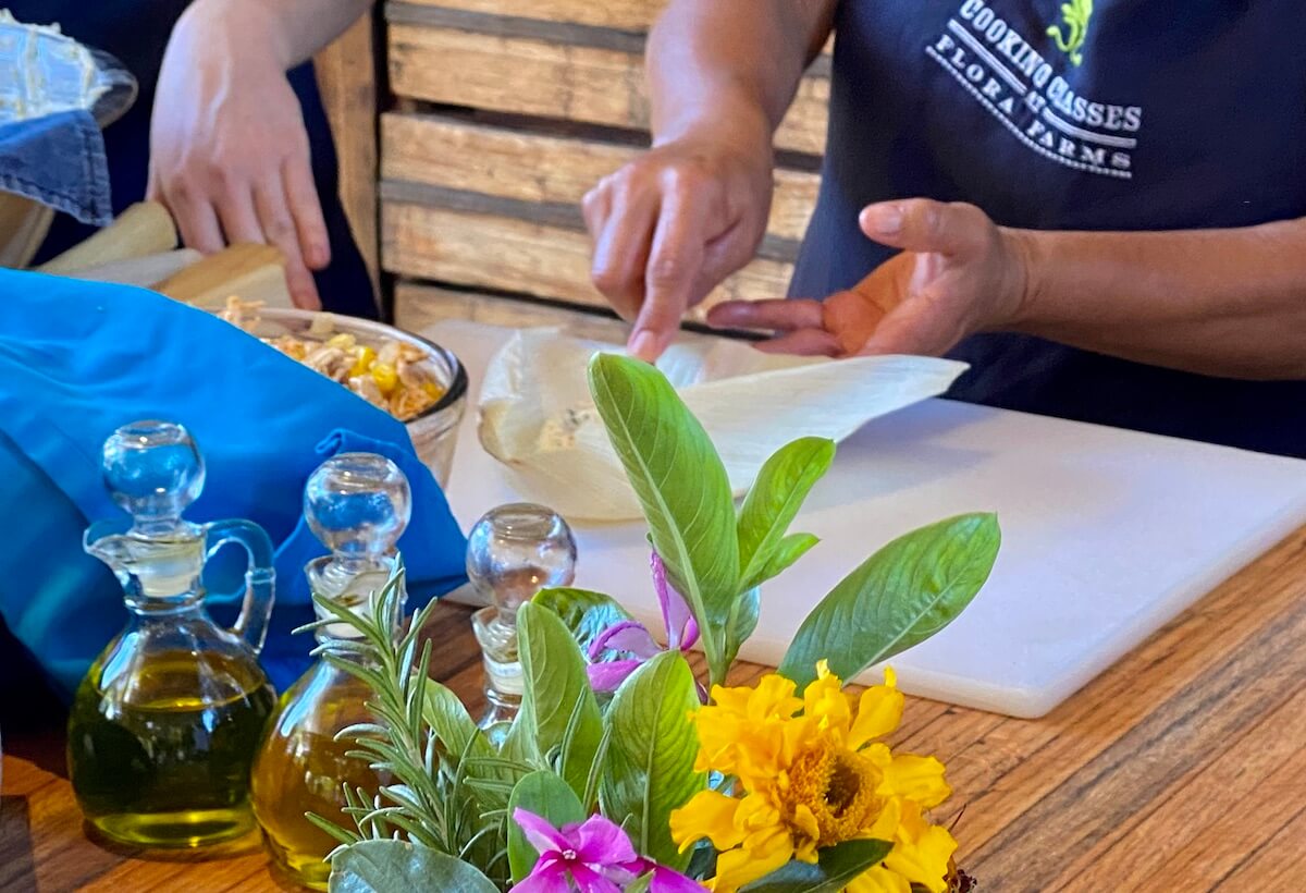 woman making tamales at flora farms