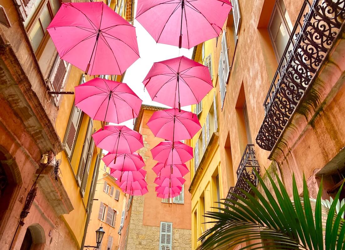 French Riviera city of Grasse with pink umbrellas