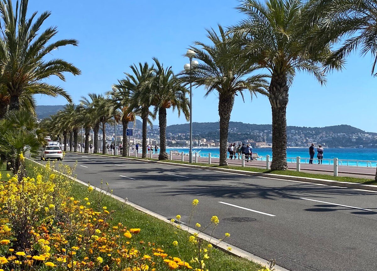 Bus route from nice airport on the Promenade des Anglais with palm trees