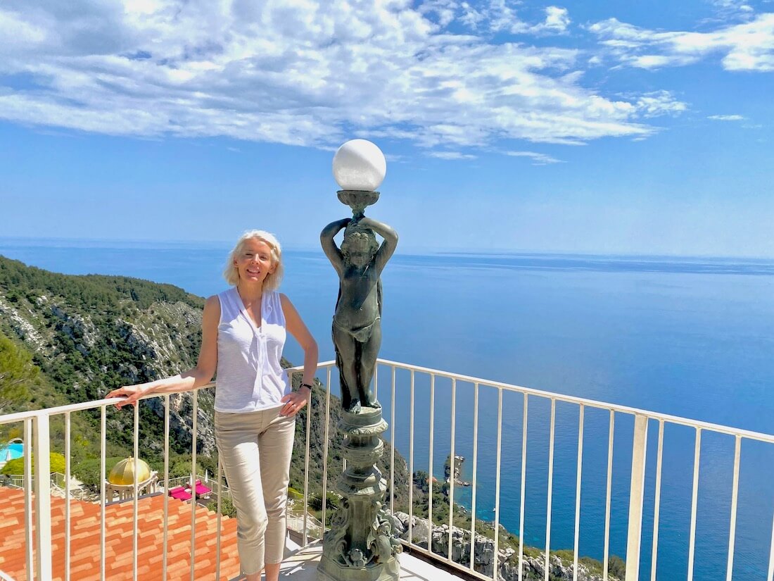 Carol Perehudoff on a terrace overlooking the Mediterranean 