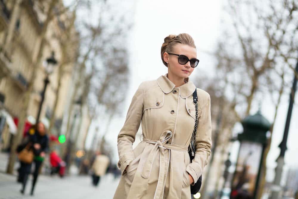 Woman in beige coat on the Champs Elysees