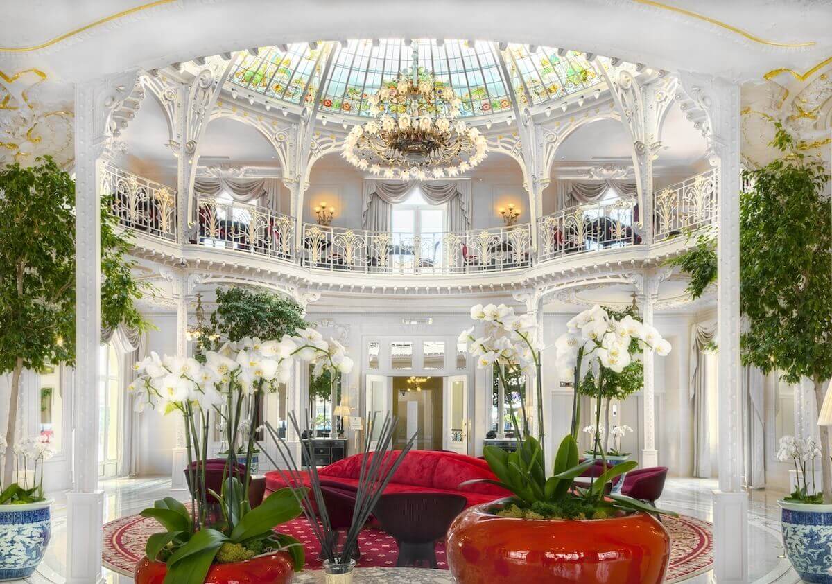 Hotel guests walk through the lobby of the Paris hotel-casino in