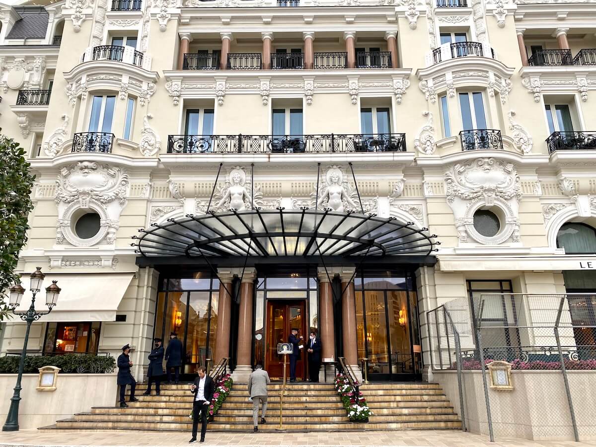 Cream colored facade of the luxury Monaco Hotel du Paris in Monte Carlo