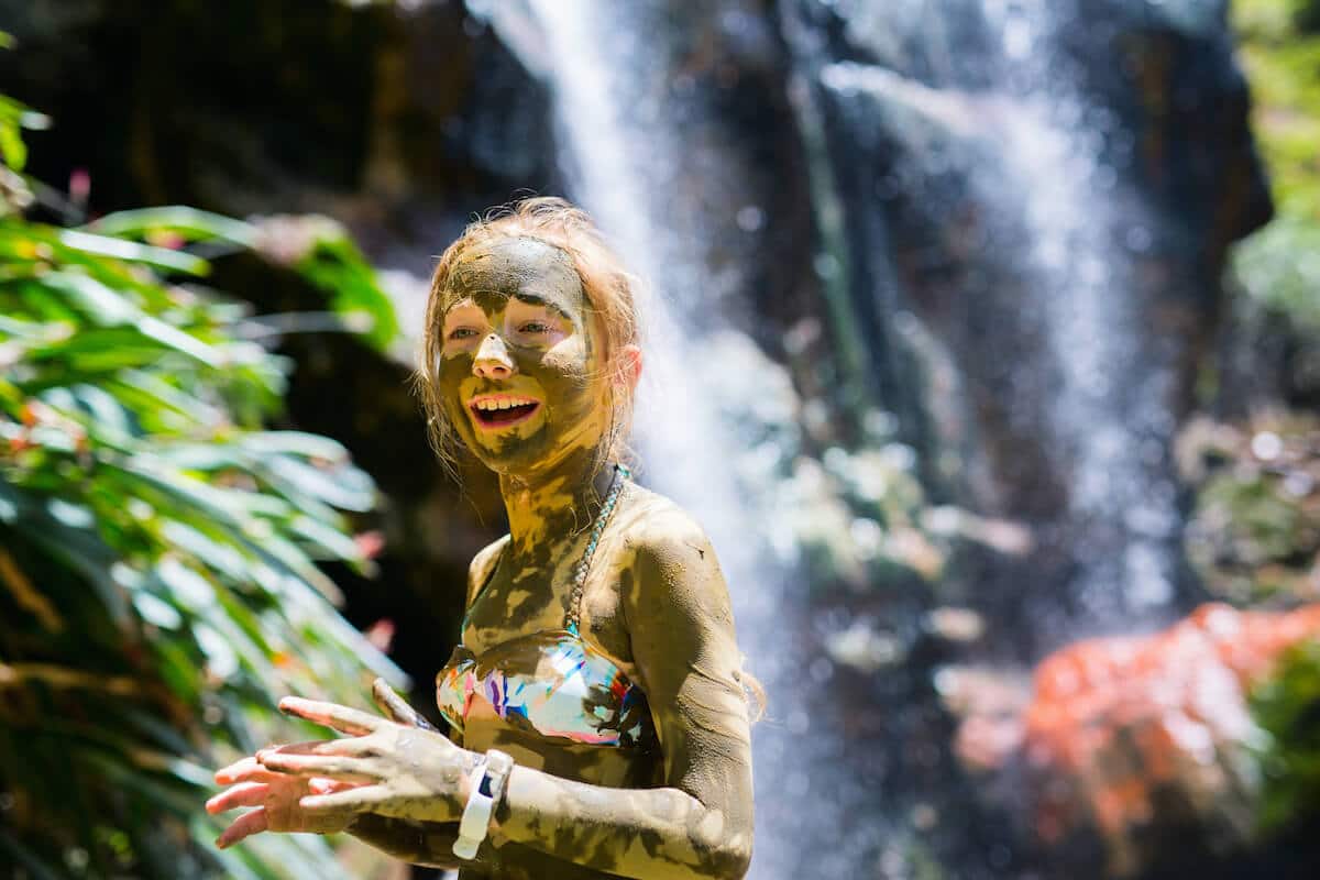 Young girl at the mineral mud baths at Soufriere