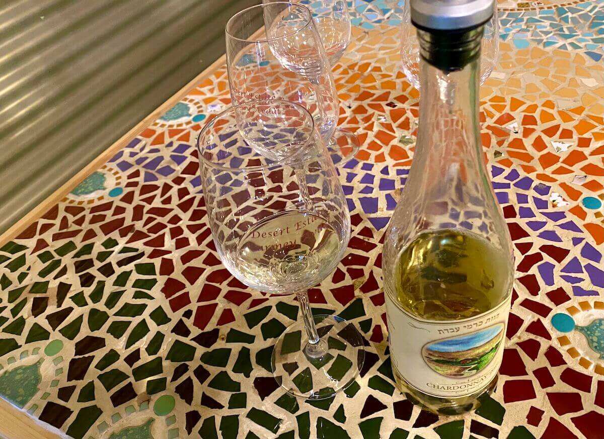 Wine bottle and glass at Carmey Farm in the Israeli desert