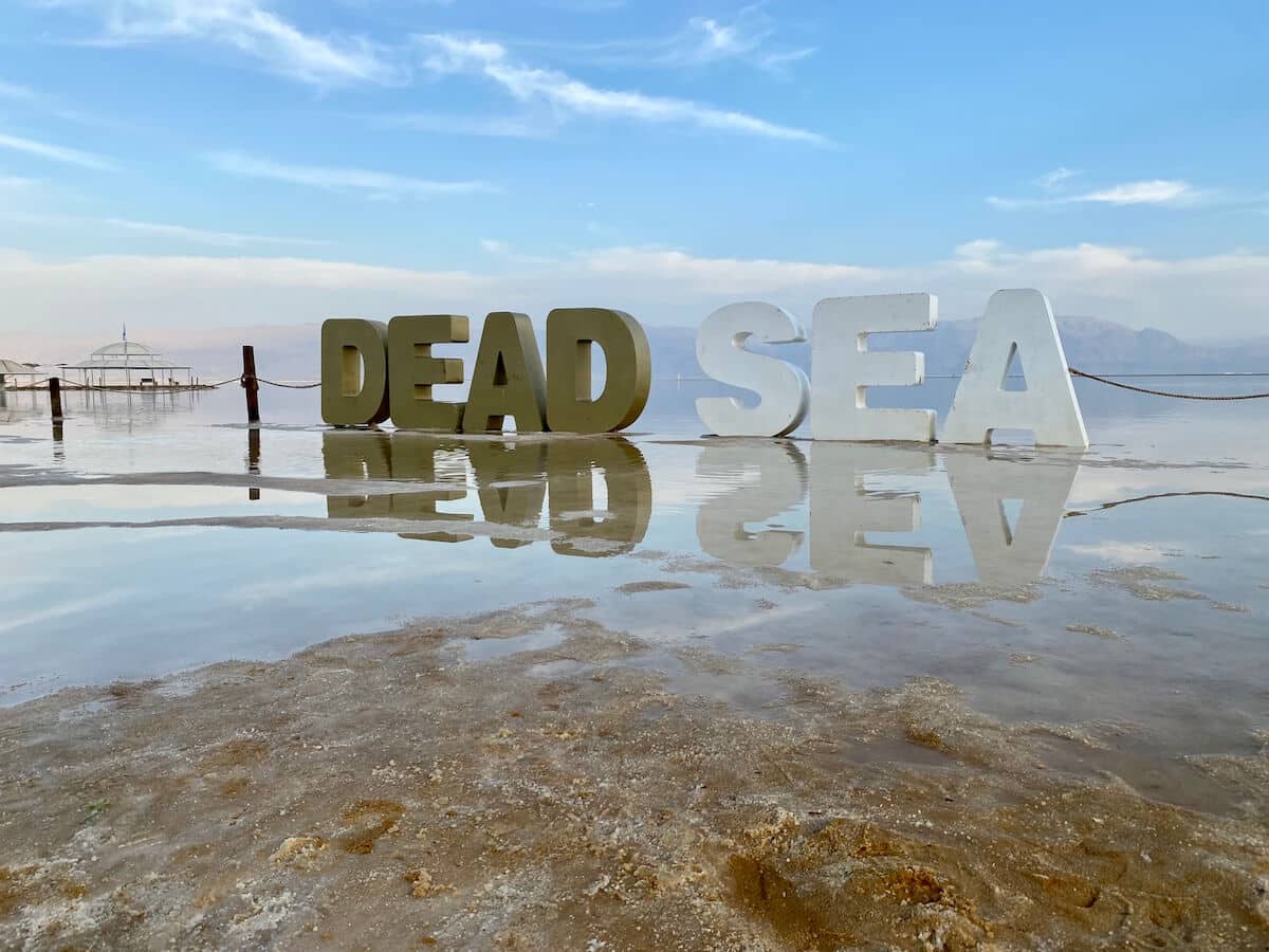 Giant Dead Sea sign on the beach at Ein Bokek