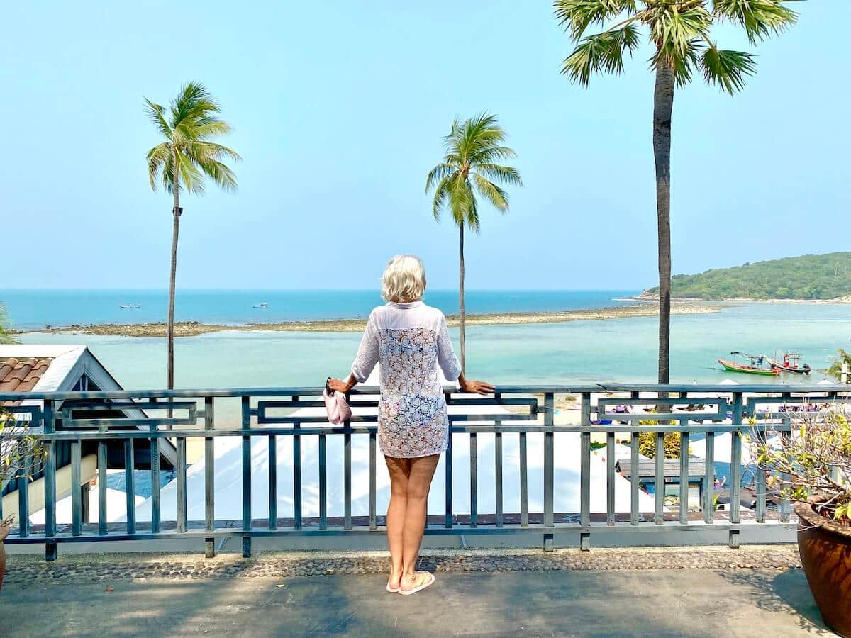 Blond woman looking out over the Gulf of Thailand