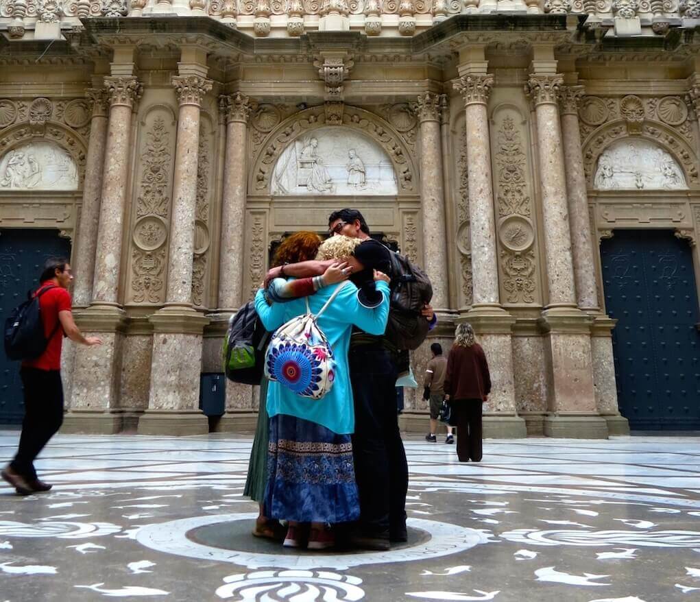 People hugging at Montserrat Monastery.