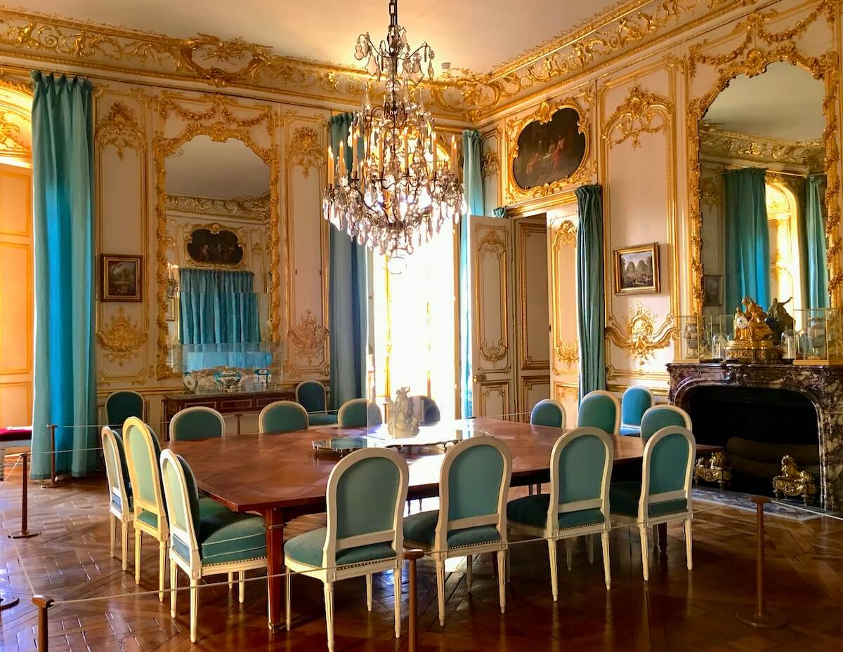 Inside an ornate dining room at the Chateau de Versailles