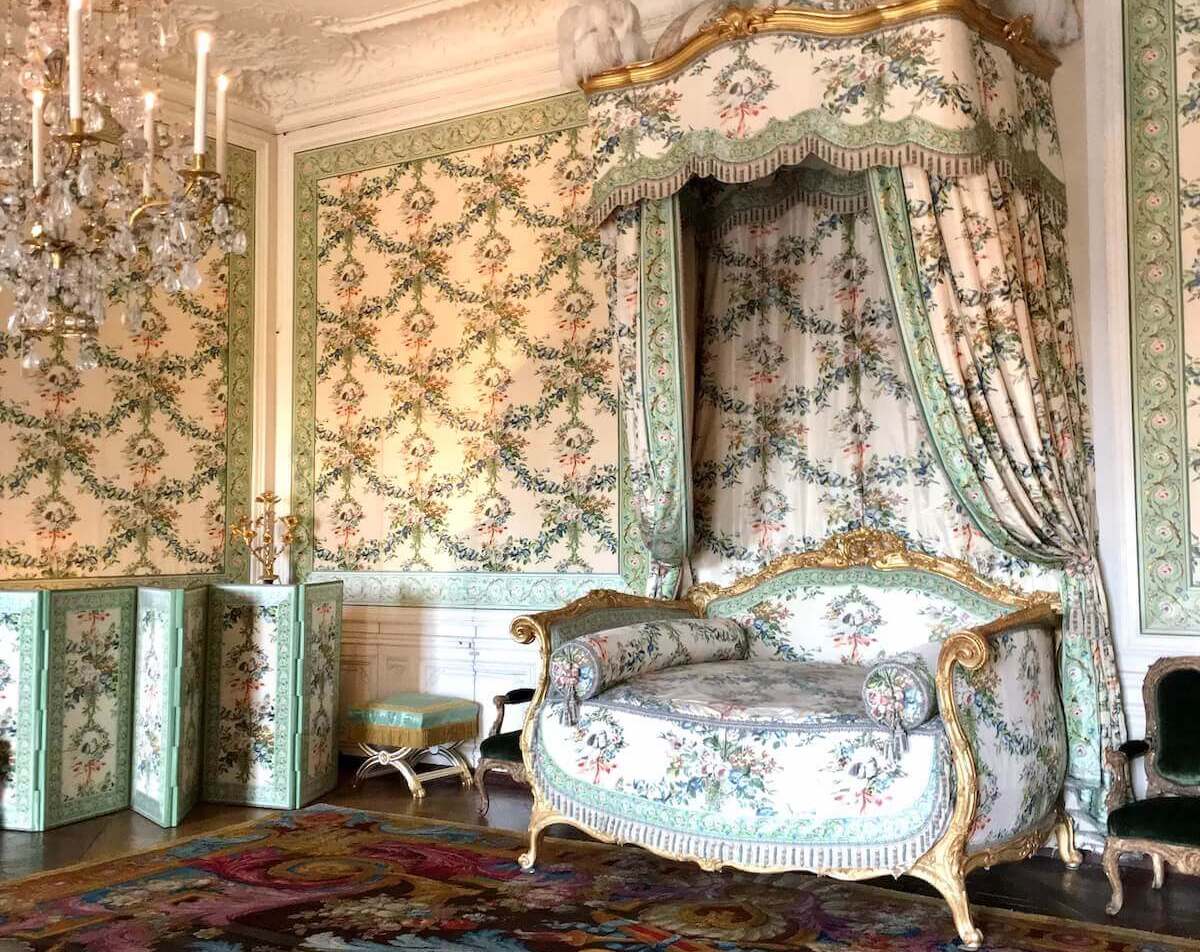 Ornate room in Versailles with green and white decor