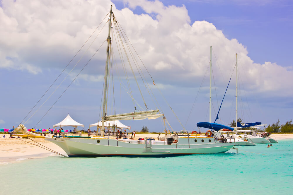 Boat in turquoise water in Turks and Caicos.