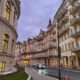 Grand street with historic buildings in Karlovy Vary.