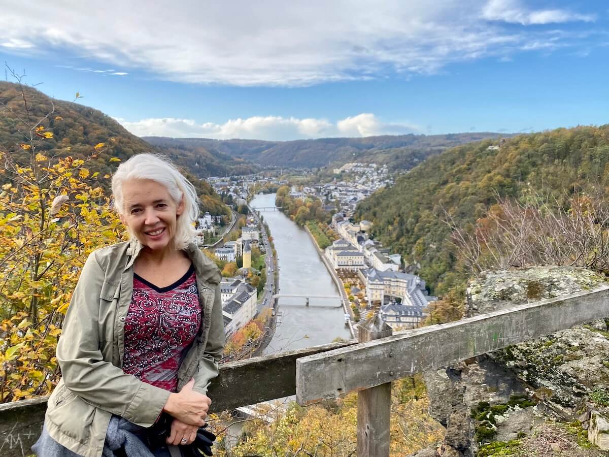 Blond woman at a viewpoint over Bad Ems and the Lahn River.