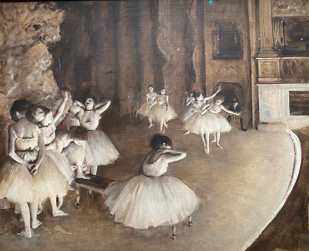 Painting of dancers on a stage by Degas.