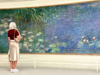 Carol Perehudoff looking at Monet paintings in Paris.