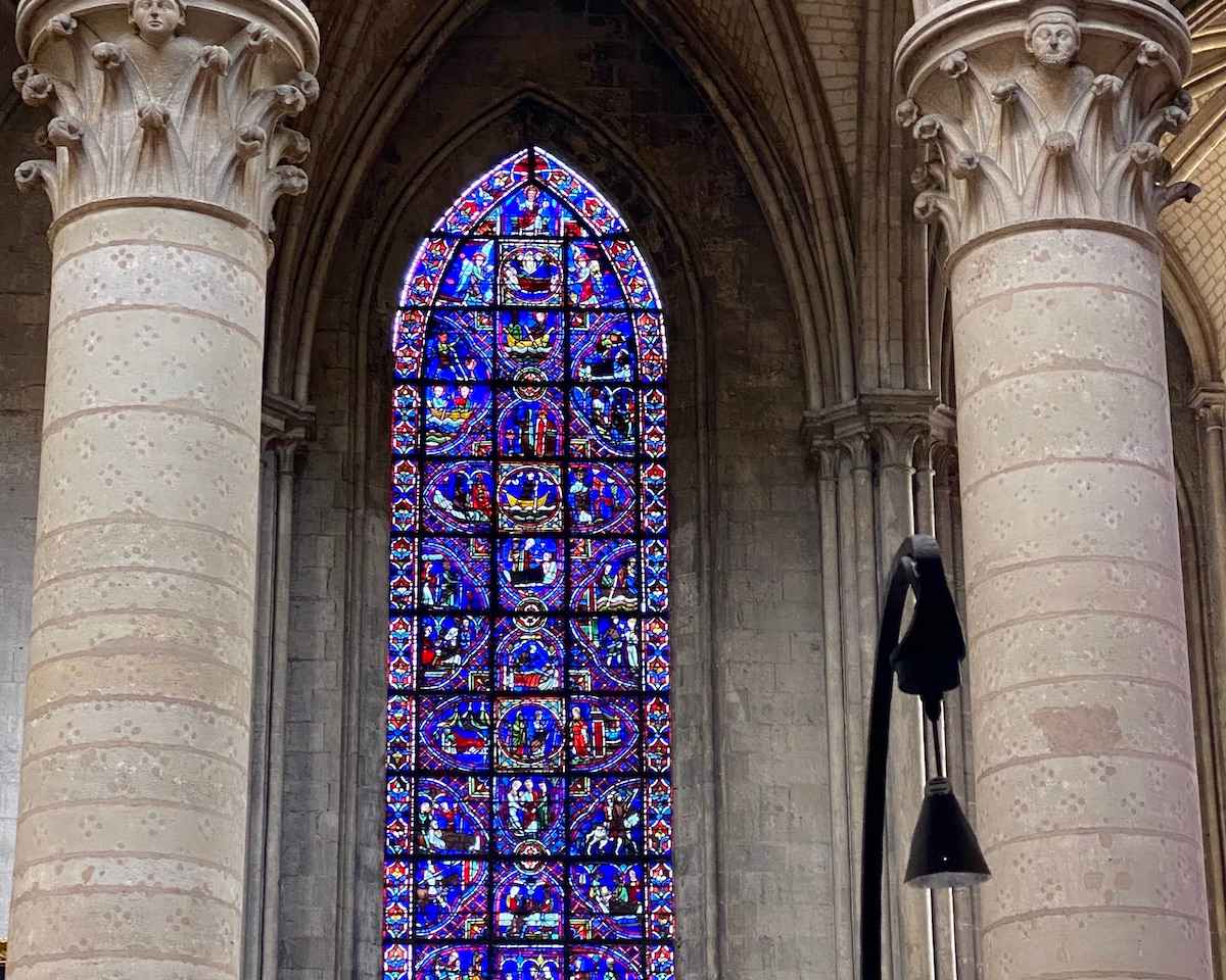 Stained glass with Gothic pillars.